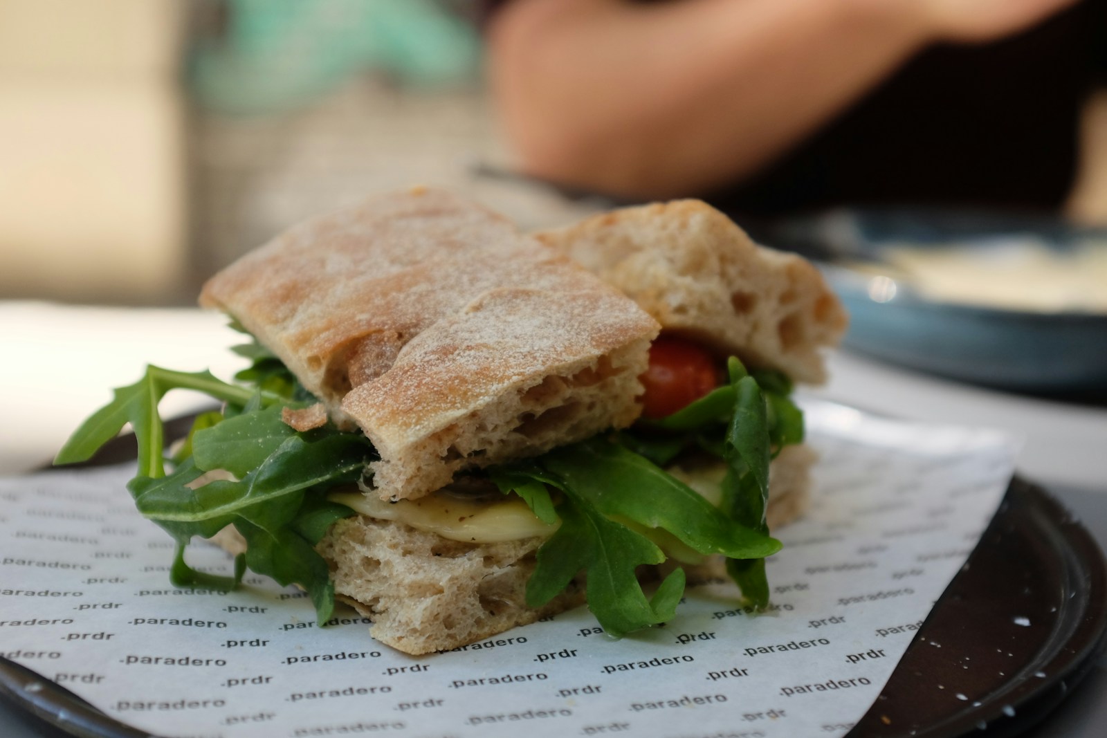 A sandwich sitting on top of a plate on top of a table
